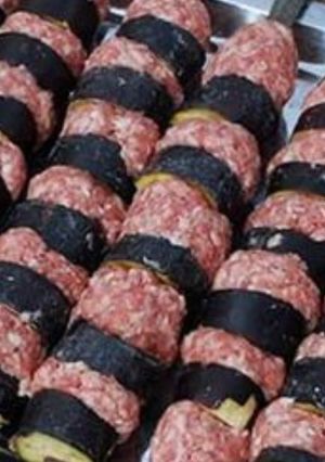 A picture of Grilled Aleppo Eggplant Kebab (Kabab Batinjan Halabi).