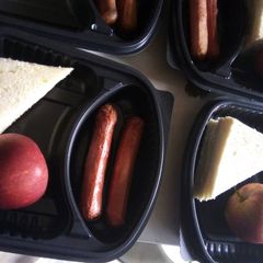 A picture of Bread,sausage and apple.
