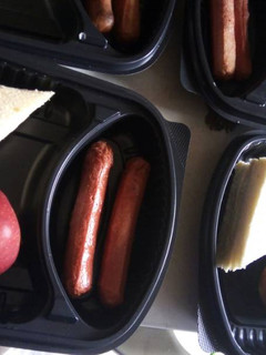 A picture of Bread,sausage and apple.