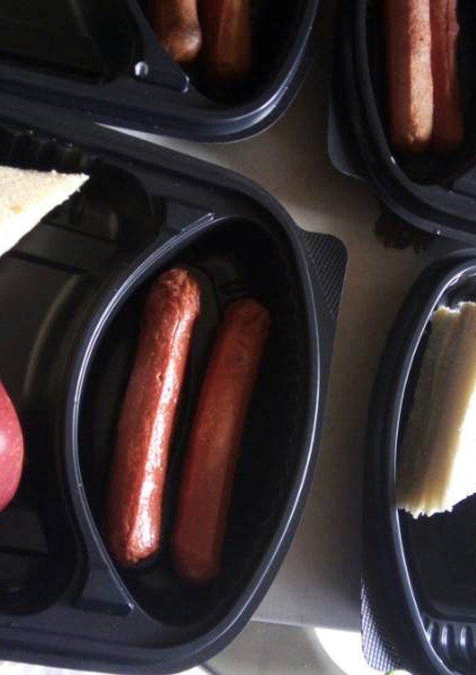 A picture of Bread,sausage and apple.