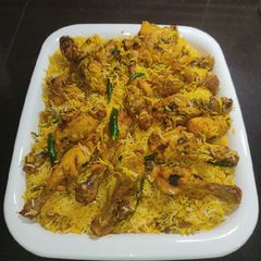 A picture of Chicken Drumsticks Tikka Biryani.