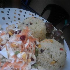 A picture of Spring Onions and Cabbage fried Rice, Graden salad with Gizzards.