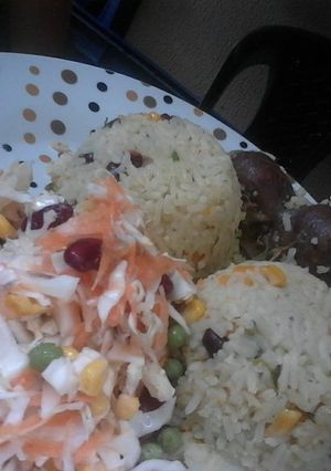 A picture of Spring Onions and Cabbage fried Rice, Graden salad with Gizzards.