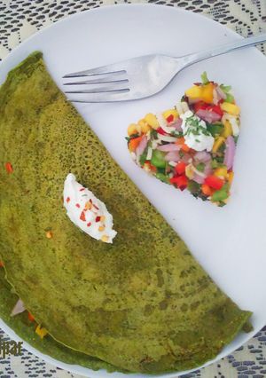 A picture of Multi grain stuffed spinach chilla.