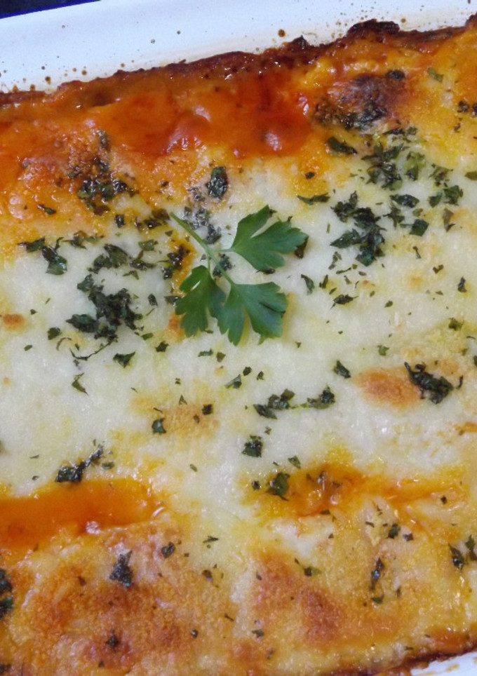 Una foto de Lasaña de salmón y gambas