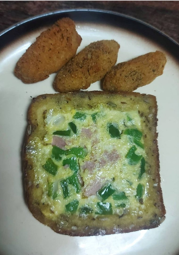 Una foto de Tostada de queso y pimiento verde