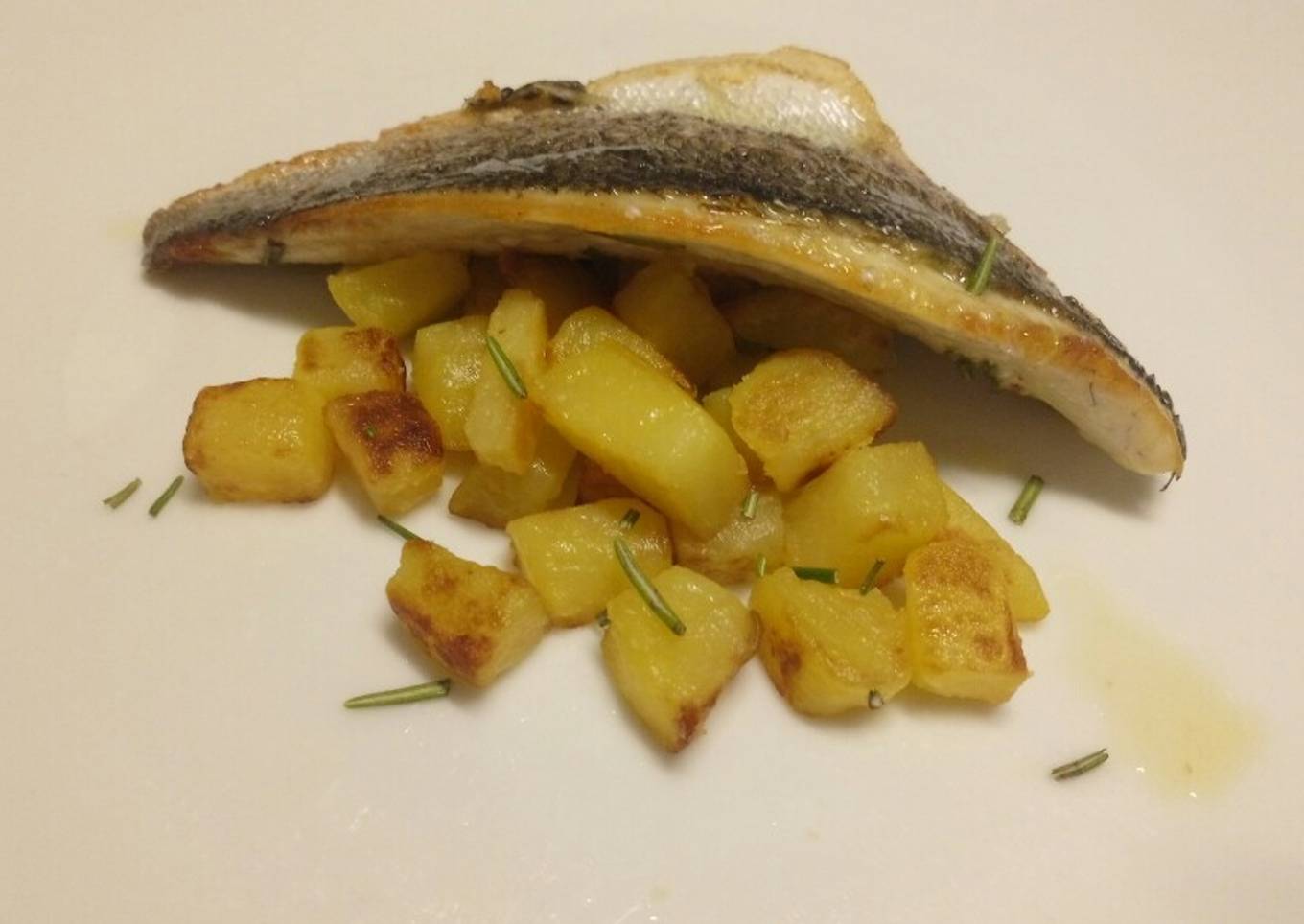 Lemon and rosemary pan fried sea bass with sautèed potatoes