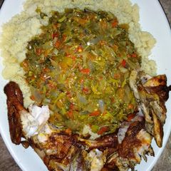 A picture of Couscous, vegetable soup and roasted chicken.