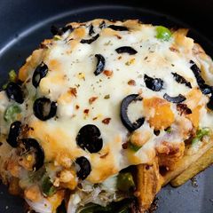 A picture of Nuggets Cheese Fries.