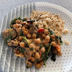 A picture of Aubergine, spinach and chickpea curry.