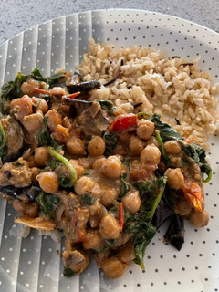 A picture of Aubergine, spinach and chickpea curry.