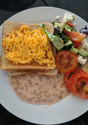 A picture of My quick baked beans salad for breakfast.