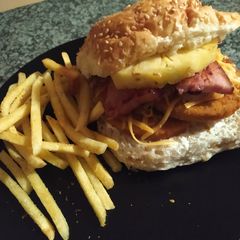 Chicken and Pineapple Burger with thick cut pork rashers A picture of Chicken and Pineapple Burger with thick cut pork rashers.