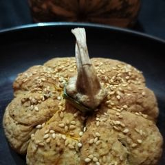 A picture of Pumpkin shape sattu bun.
