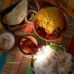 A picture of Gujarati khatta moong and rice.