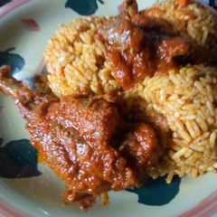 Vegetable Jollof rice with stewed chicken and gizzard A picture of Vegetable Jollof rice with stewed chicken and gizzard.