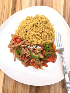 A picture of Saffron Rice and Chicken Sauce.