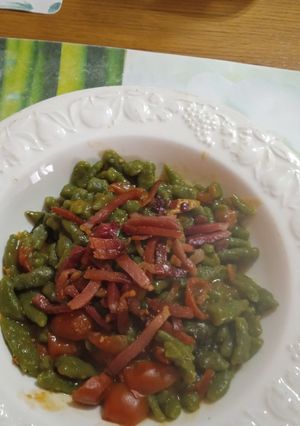 A picture of Tyrolean Spinach Gnocchi with Quick Cherry Tomato Sauce and Crispy Speck.