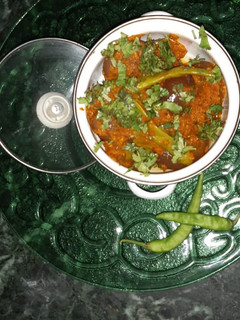 A picture of Stuffed onion with green chilli.