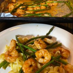 A picture of Buttery boiled shrimp and Asparagus.