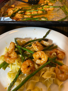 A picture of Buttery boiled shrimp and Asparagus.