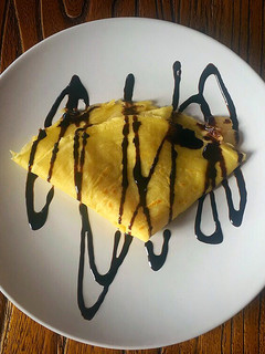 Una foto de Crêpes con compota de pera