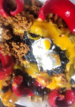 A picture of Loaded Waffle Fries (w/meats, beans, chz, jalepeno, sour cream).