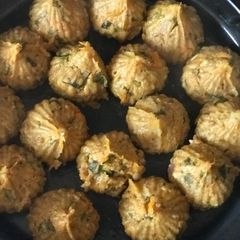 A picture of Left over khichadi and carrot paneer paratha masala muthia (steamed dumplings).