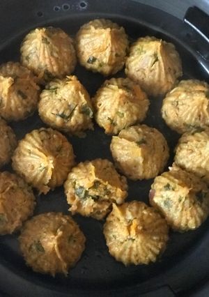 A picture of Left over khichadi and carrot paneer paratha masala muthia (steamed dumplings).