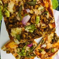 Chicken tikka pizza A picture of Chicken tikka pizza.