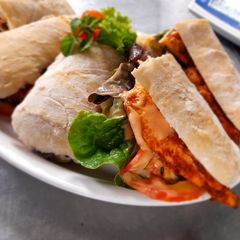A picture of Grilled chicken tikka ciabatta.