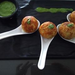 A picture of Stuffed aalo bonda in appe pan.