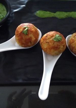 A picture of Stuffed aalo bonda in appe pan.