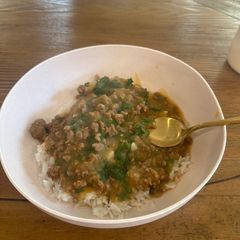 A picture of Caldo Verde Soup over White Rice.