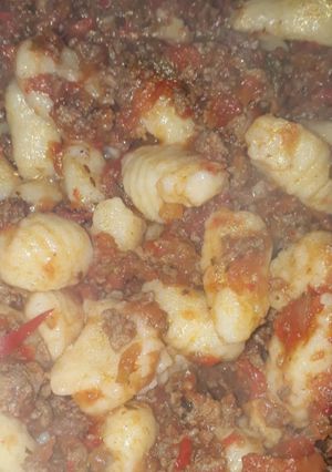 Una foto de Ñoquis caseros con bolognesa
