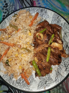 A picture of Corn Veg Pulao with beef chilli.