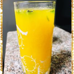 A picture of Muddled mint orange juice.