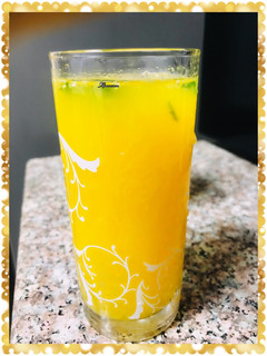 A picture of Muddled mint orange juice.