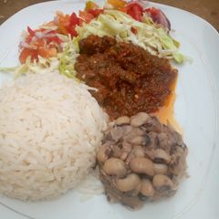 A picture of Simple Rice and beans with stew.