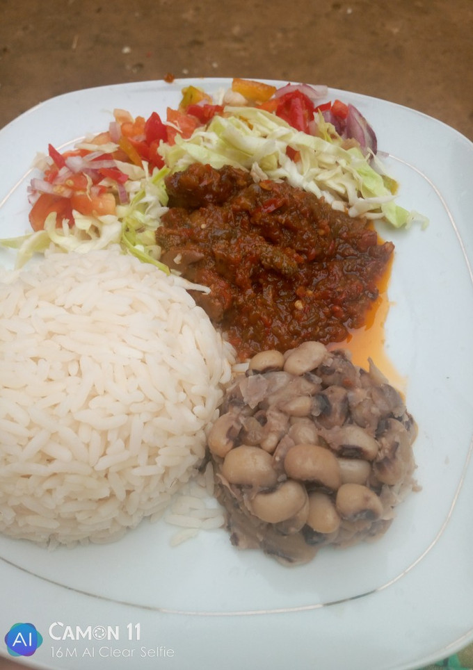 A picture of Simple Rice and beans with stew.