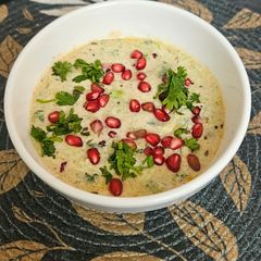 A picture of Cucumber raita with Pomegranate crunch.