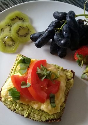 A picture of Open face avocado and egg sandwich.