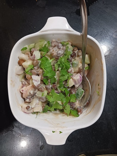 A picture of Chana salad with Thousand Island dressing.