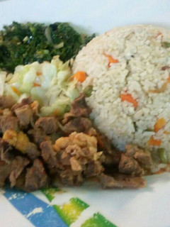 A picture of Vegetable rice served with beef stew and vegetables.