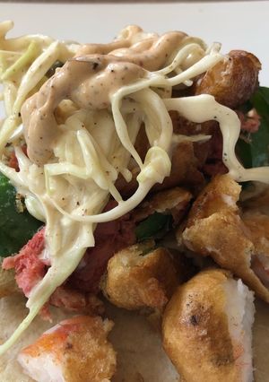 A picture of Sonoran-Style Battered Shrimp Tacos and Stuffed Jalapeños with Smoked Marlin.