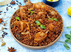 A picture of Bhopali Red Rice Chicken Biryani.