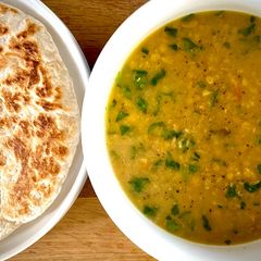 A picture of Kara Paruppu Roti Canai - lentil curry with flatbread.