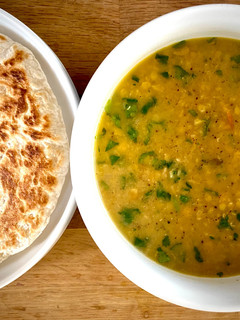 A picture of Kara Paruppu Roti Canai - lentil curry with flatbread.