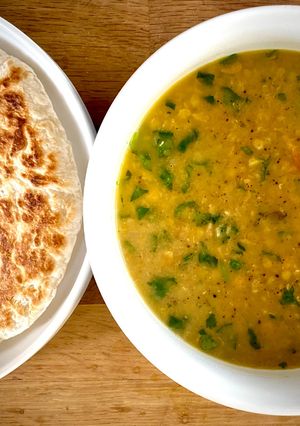 A picture of Kara Paruppu Roti Canai - lentil curry with flatbread.