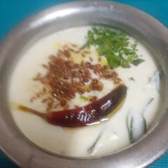 A picture of Gujarati Kadhi ---- A Curry that soothes Your Cravings & Taste Buds In The Receding Monsoons.